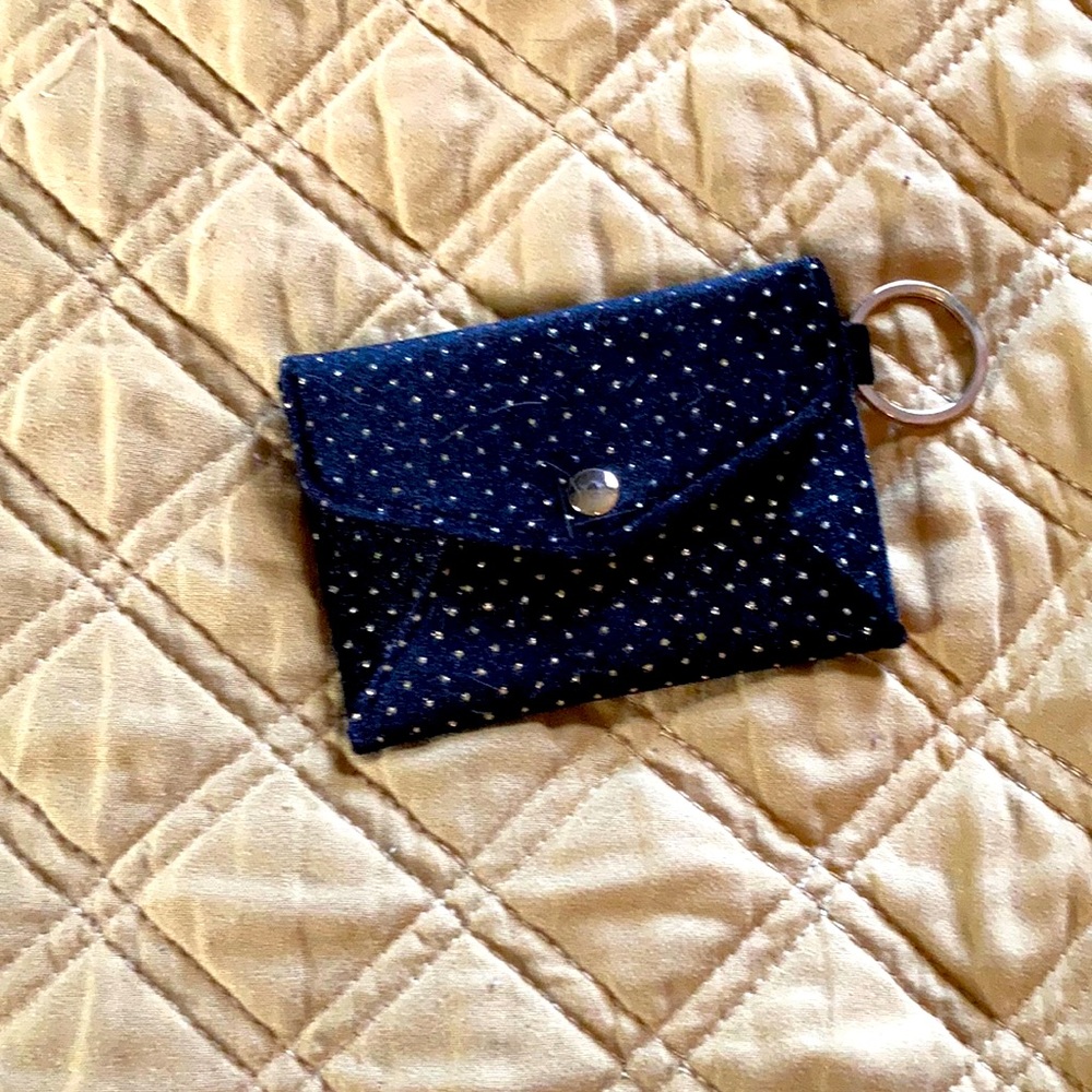 Old Navy small wallet, black with gold polka dots. Attached keyring